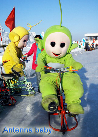 Sun Island in Harbin Ice Fair at the scene, cartoon characters riding the bike and ice playing with visitors