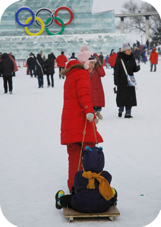 A mother and child the banks of the Songhua River in Harbin ice playing field